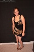 Seductive exotic housewife posing in a sexy dress and high heels trying