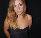 Blonde MILF in a black dress exposing her asshole and tits