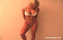 Cute blonde milf in brown jeans and black top shows big tits and gives