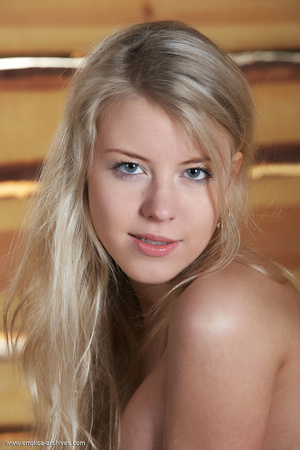Blonde youngster naked on a rug on top o - Picture 9