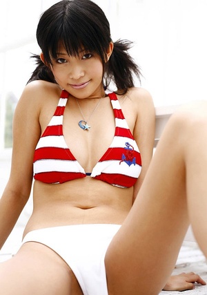 Saucy shiela posing in her striped swimsuits and some topless shots. - XXXonXXX - Pic 3