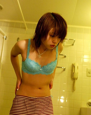 Bird removes her lacy baby blue underwear and gets in the tub. - Picture 3