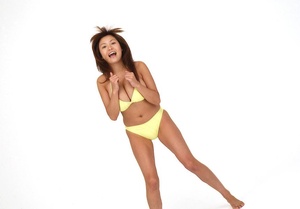 Voluptuous vixen does some sexy poses in her yellow bikini. - Picture 9