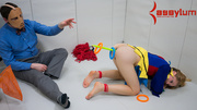 Hogtied pigtailed blondie in a clown's suit tortured and fucked with various objects in an asylum ward