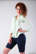 Outstanding senora in a white blouse and knee high shorts strips to show