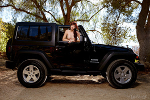 Thin babe in blue short and top undresses and strip infront of a jeep outdoor. - Picture 12