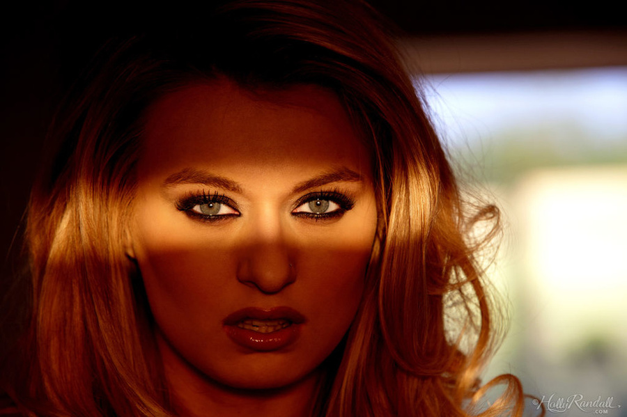 Amazing blonde in a red bra and panties pose in the living room on a black sofa. - XXXonXXX - Pic 6