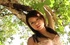 Hot Japanese teeny in a beige lingerie posing on the sand at the water
