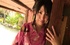 Hot Japanese seductress in a pink kimono posing on the floor