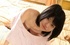 Slim Asian teen babe in pink panties and white sweater on the bed