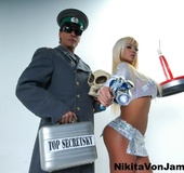 Chica in her sexy space uniform poses with Russian secret agent.