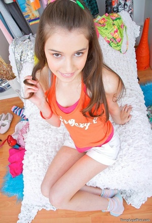 Tiny treasure in an orange shirt and white shorts does anal. - Picture 1