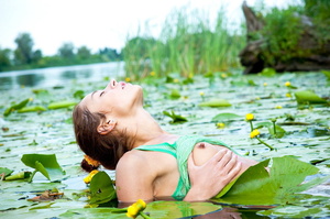 Scrawny teen in a green shirt and white panties stripping in a lily pond. - Picture 7