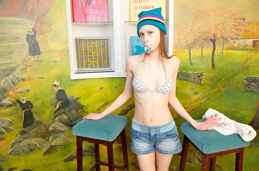 Lean lass in a bonnet getting naked on a blue stool. - XXXonXXX - Pic 5
