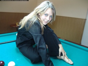 Playful blonde slips off overall on snooker table to show off hot tits and booty - Picture 1