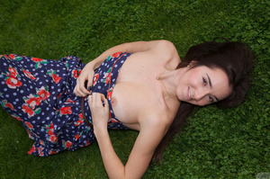 Lovely brunette coed in a floral dress a - Picture 12
