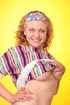 Teen chick in a striped blouse and hisr band exposing her big fun bags