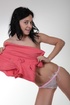 Playful brunette teeny in white thong takes off her coral one-piece to