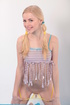 Teen cutie with funny pigtails in a sexy top with fringe