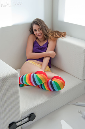 Girl-next-door with socks on sure is worth cozying up with on a couch. - Picture 7