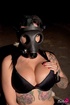 Kinky babe in black bra, panties, wears gas mask, smokes and shows off
