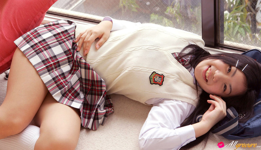 Wench poses in her sweater vest and school uniform on a red sofa. - XXXonXXX - Pic 7