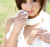 Slut in a white scarf and lingerie posing in the field.