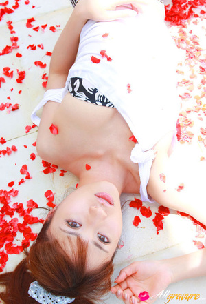 Broad in a bandeau bikini poses on some red flower petals. - XXXonXXX - Pic 11