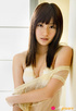 Strumpet in a sheer chemise and white lingerie poses by the door.