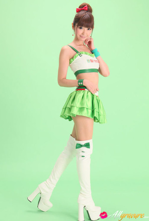 Bird in a green skirt and white boots posing in front of a green background. - XXXonXXX - Pic 4