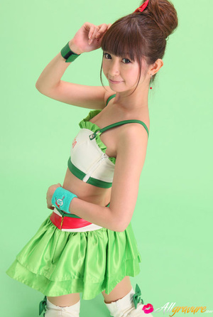Bird in a green skirt and white boots posing in front of a green background. - XXXonXXX - Pic 13