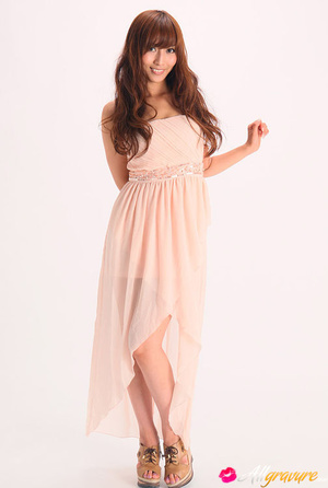Vamp poses in her pink dress and wedges against a white background. - XXXonXXX - Pic 3