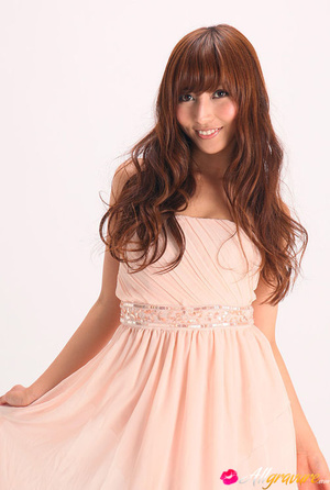 Vamp poses in her pink dress and wedges against a white background. - XXXonXXX - Pic 5