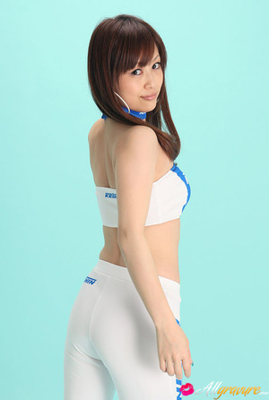 Nympho in white boots and pants posing in front of a blue background. - XXXonXXX - Pic 4