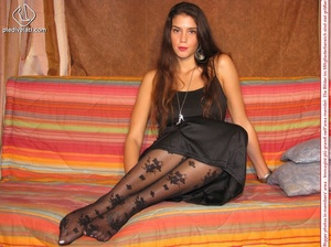 Lovely brunette teeny looking not so innocent in her floral pantyhose and long black evening dress - Picture 8