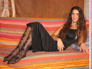 Lovely brunette teeny looking not so innocent in her floral pantyhose and long black evening dress - Picture 9