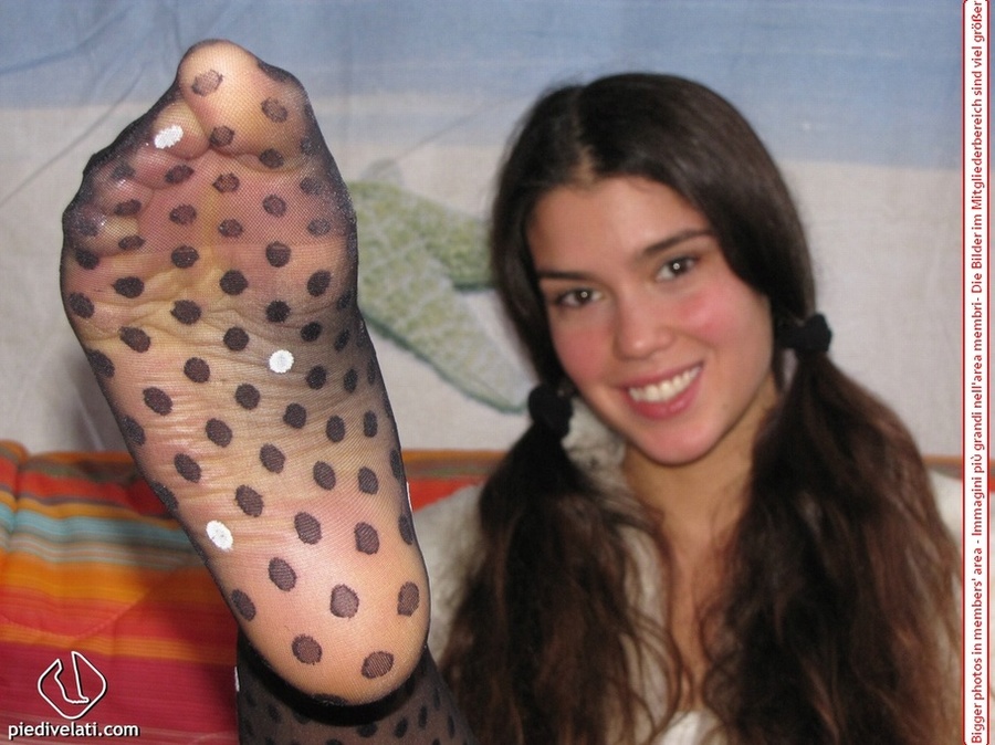 Playful brunette freshie in a white blouse teasing you with her slim legs in polka-dot tights - XXXonXXX - Pic 9