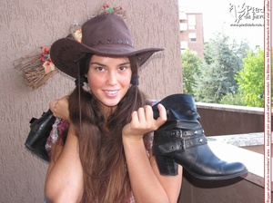 Little brunette pigtailed cowgirl wearing a hat, checked shirt and pantyhose looking dangerous with her gun - Picture 8