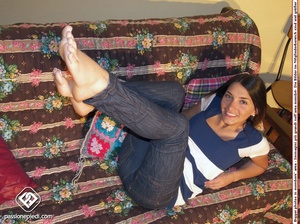 Brunette freshie in a striped T-shirt and jeans takes off her sneakers - XXXonXXX - Pic 4