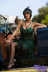 Gorgeous chick goes retro as she fabulously poses in an elegant green