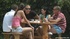 Two brunette hotties taking part in a cool group fucking at the pool