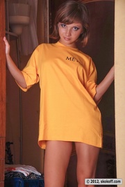 Lovely toots in a yellow shirt and white panties at the closet.