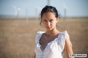 Glamorous shiela takes off her white nightie amongst the wind generators. - Picture 2