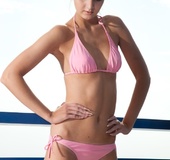 Captivating toots sheds her striped dress and pink bikini on the terrace.