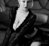 Desirable female in black lingerie poses for some black and white nudes.