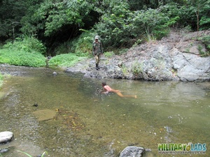 Naked swimmer sucks on a military guy’s knob by the water. - Picture 4