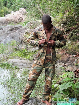 Camo-clothed hunk strips and exposes his dong near the river. - Picture 1