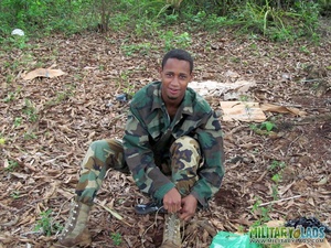 Gentleman in battle dress uniform lays down on fallen leaves to display his dick. - Picture 4