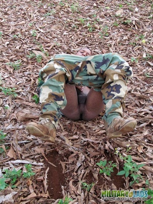 Gentleman in battle dress uniform lays down on fallen leaves to display his dick. - Picture 10