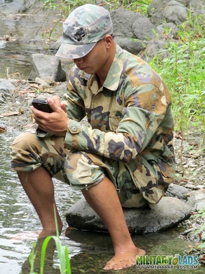 Two men in camo clothes chilling out by the river. - Picture 7